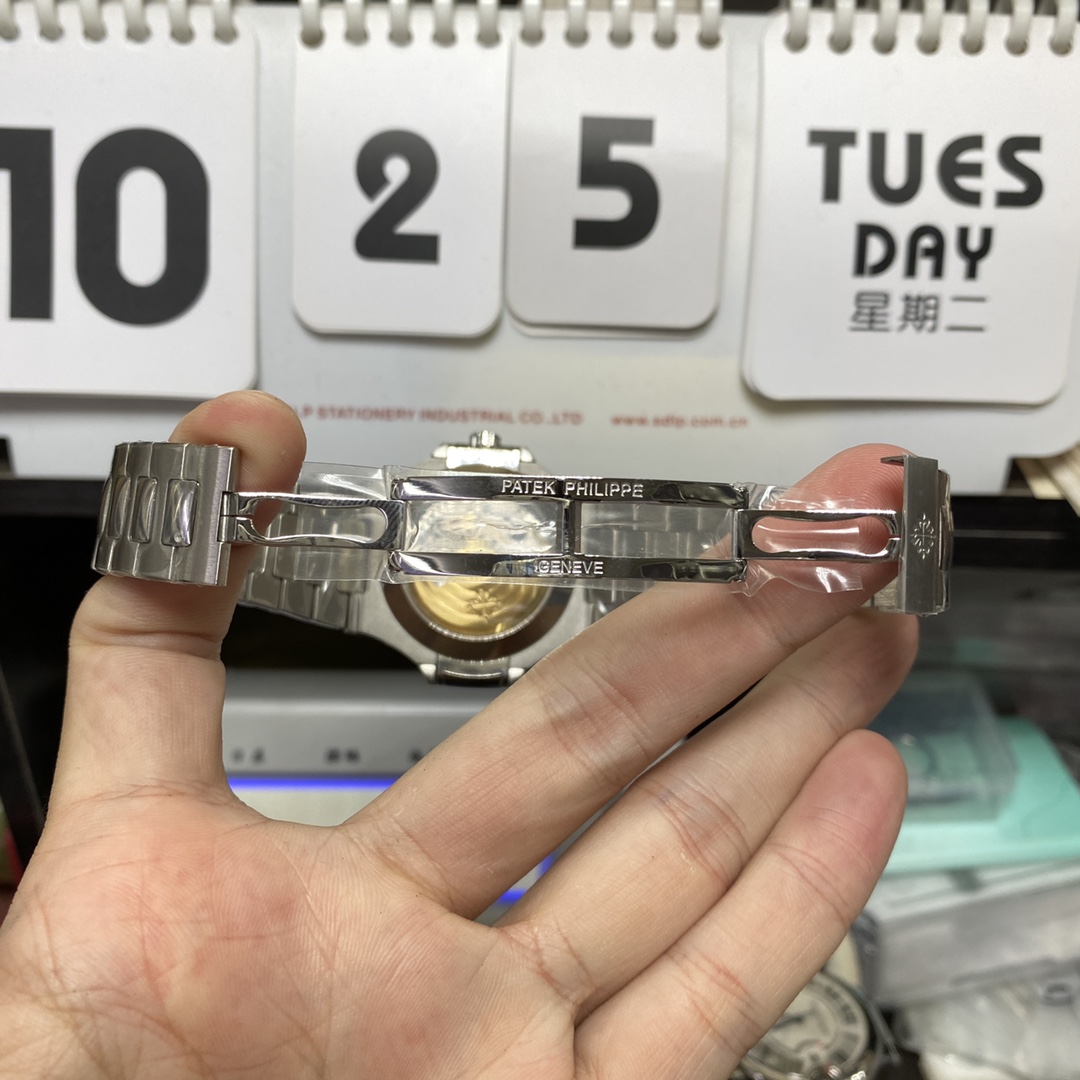 Patek Philippe Nautilus series 57261A-014, Blue Dial Steel Bracelet, Moon Phase Calendar Central Month and Week Display, 40.5mm Size.