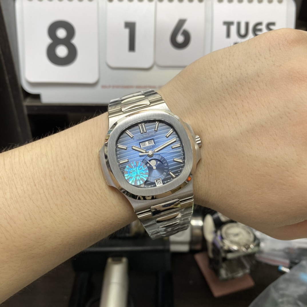 Patek Philippe Nautilus series 57261A-014, Blue Dial Steel Bracelet, Moon Phase Calendar Central Month and Week Display, 40.5mm Size.