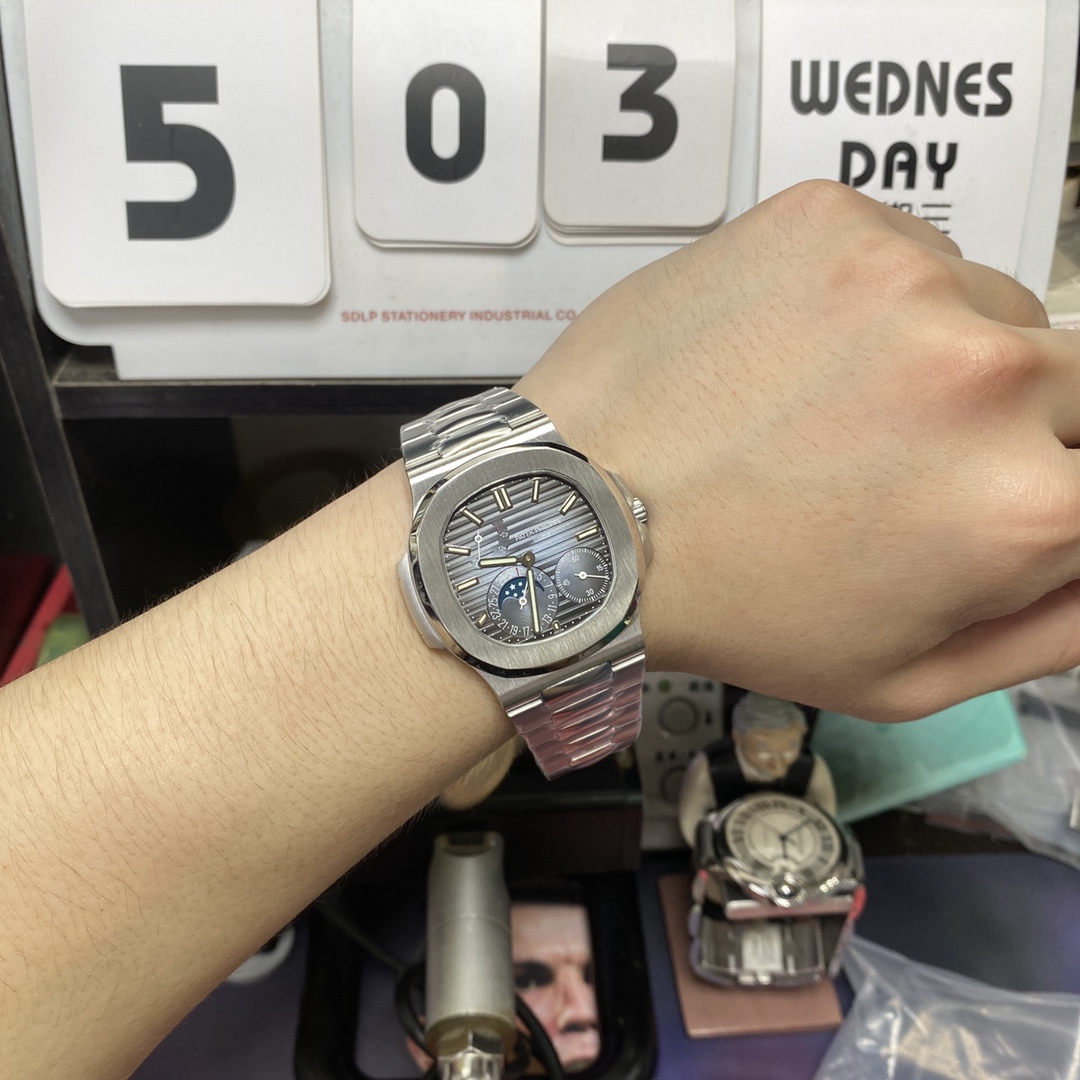 Patek Philippe Nautilus series 57121A-001, Blue Dial Steel Bracelet, Synchronized Functions, 40mm size.